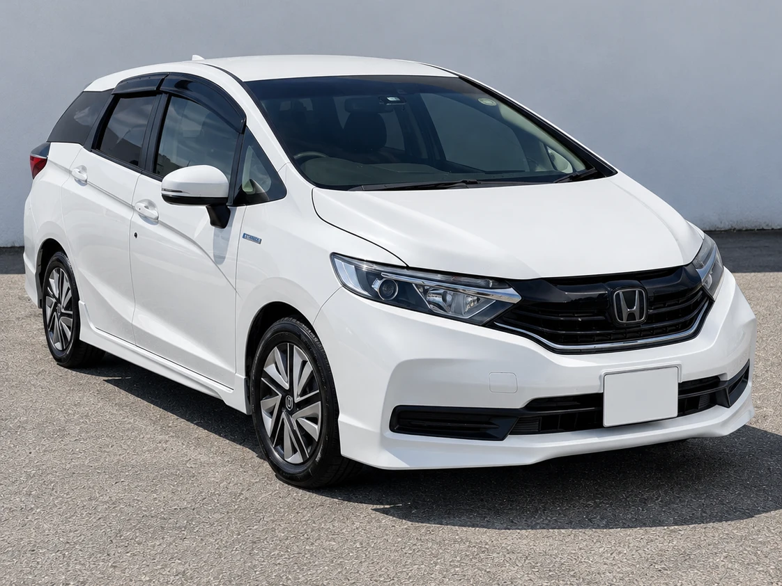 White 2021 Honda Shuttle viewed from the front and right side