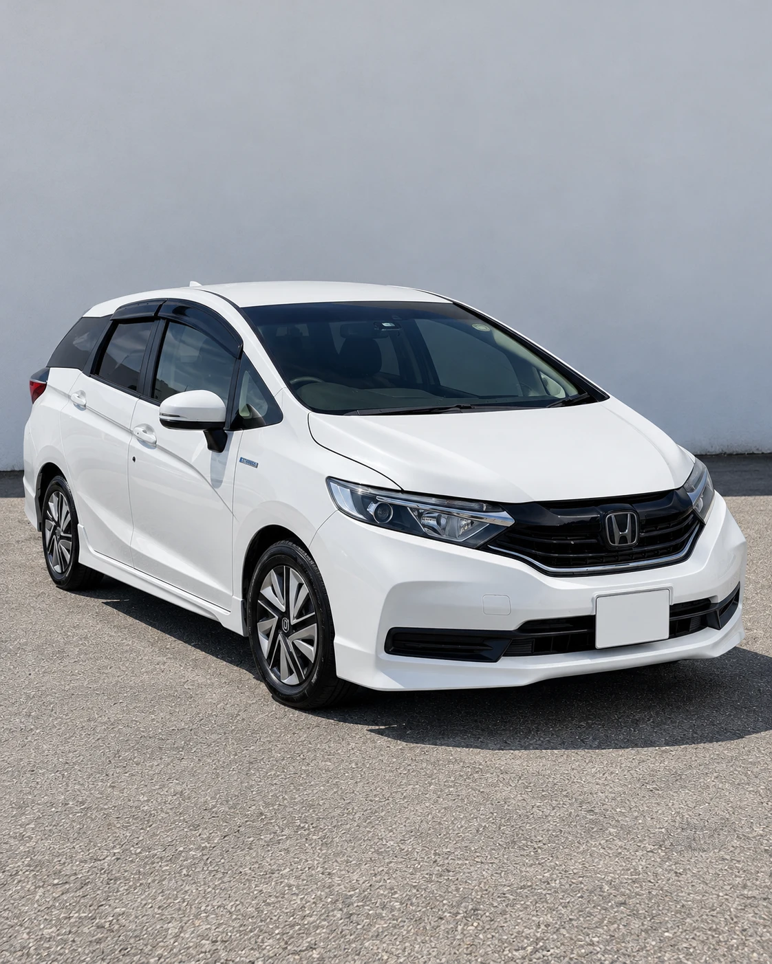 White 2021 Honda Shuttle viewed from the front and right side
